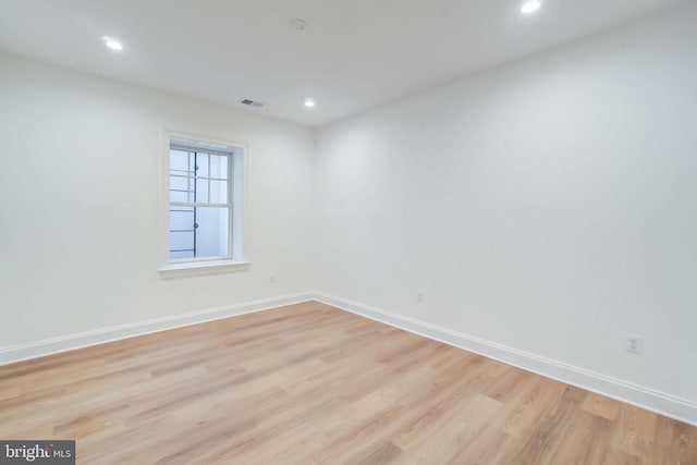 unfurnished room with light hardwood / wood-style floors