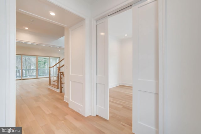 hallway with light wood-type flooring