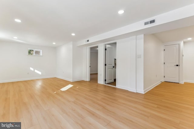 spare room with light hardwood / wood-style flooring