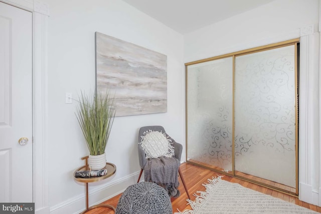 living area with wood-type flooring