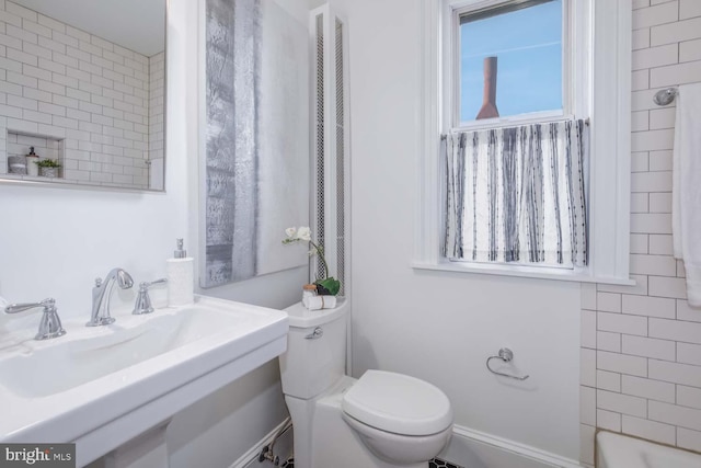 bathroom with sink and toilet