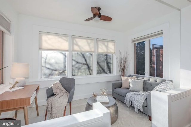 tiled living room featuring ceiling fan