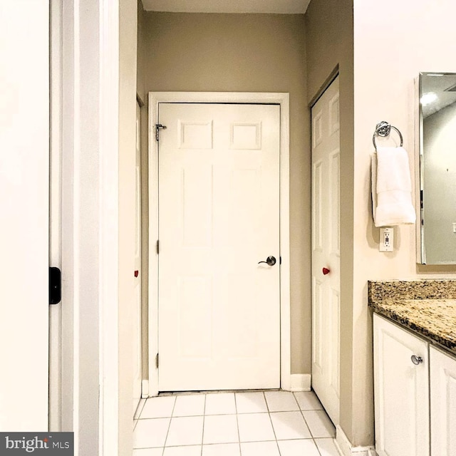 bathroom with vanity and tile patterned floors