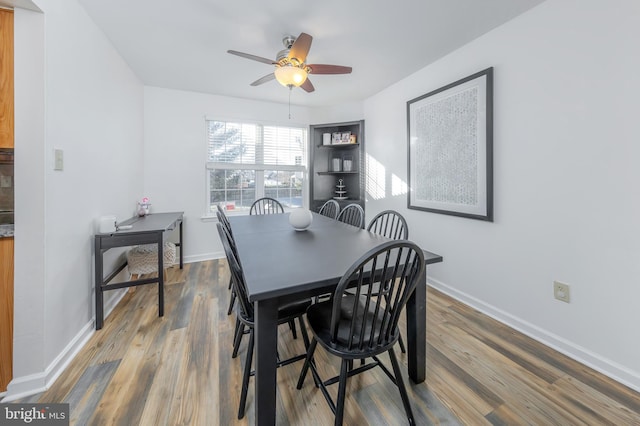 dining area featuring ceiling fan and hardwood / wood-style flooring