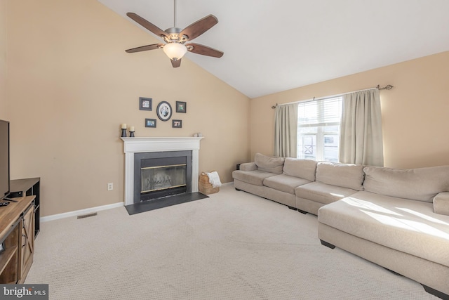 carpeted living room featuring vaulted ceiling and ceiling fan