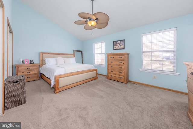 bedroom featuring ceiling fan, light colored carpet, and lofted ceiling