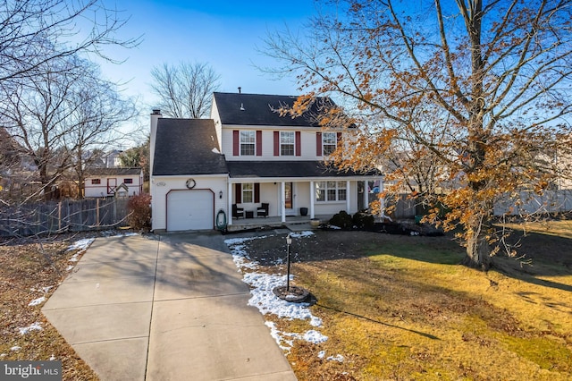 view of front of home featuring covered porch, a front lawn, and a garage