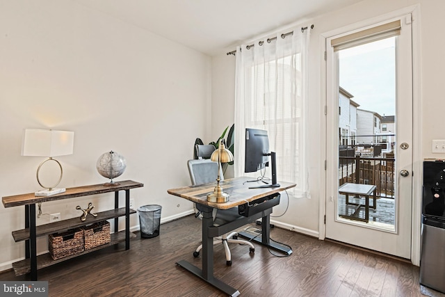 home office featuring plenty of natural light and dark hardwood / wood-style floors