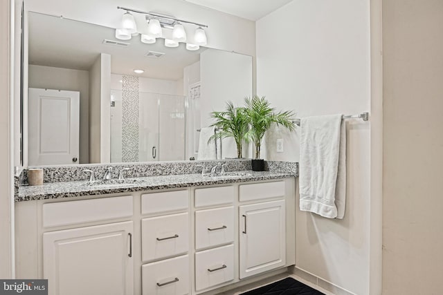 bathroom with vanity and an enclosed shower