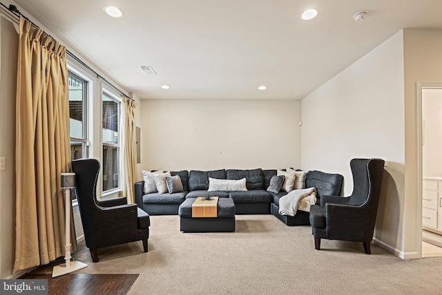 living room featuring light colored carpet