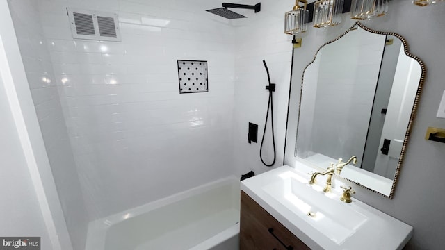 bathroom with shower / washtub combination and vanity