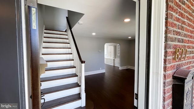 stairs with hardwood / wood-style flooring