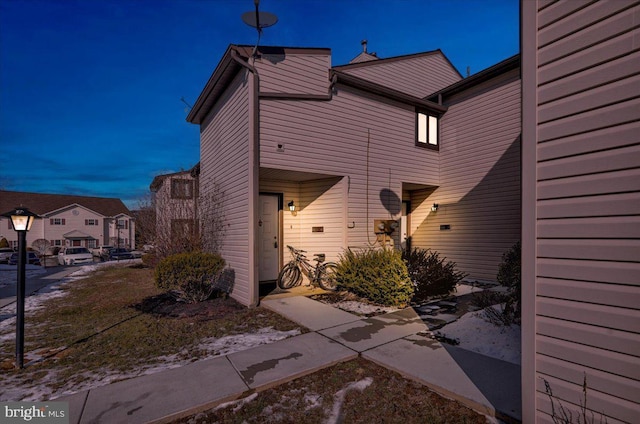 view of property exterior at dusk