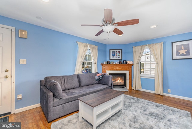 living room featuring hardwood / wood-style flooring and ceiling fan