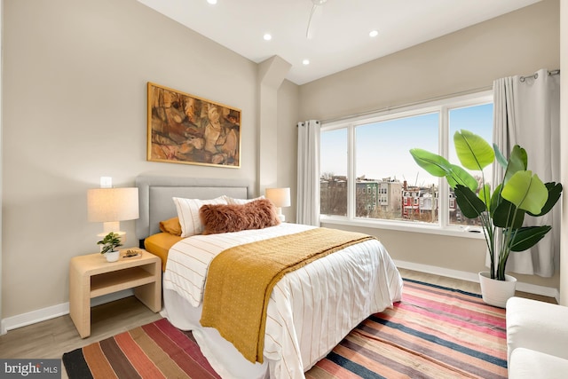 bedroom with hardwood / wood-style flooring