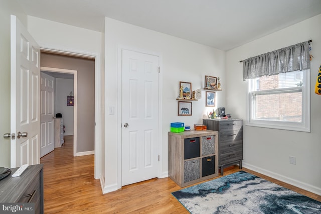 bedroom with light hardwood / wood-style flooring