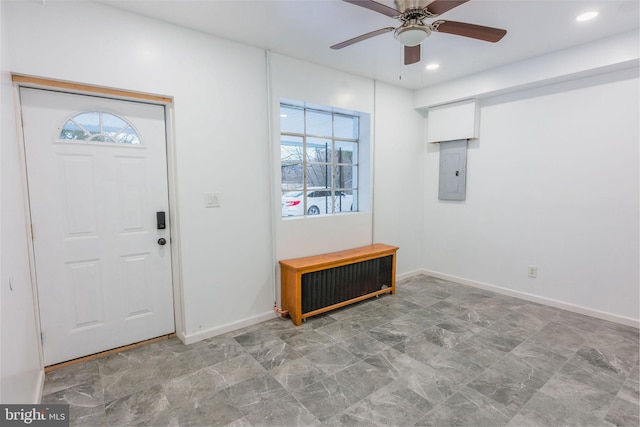 foyer featuring radiator heating unit, electric panel, and ceiling fan