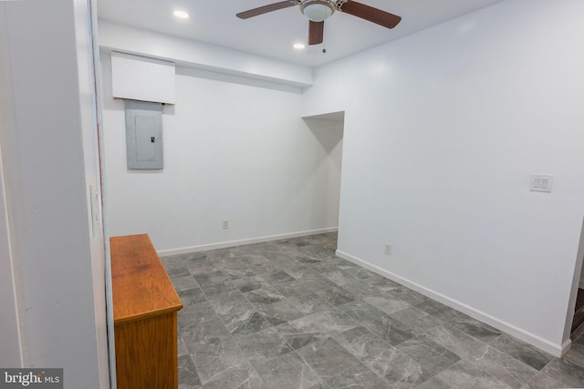 empty room featuring electric panel and ceiling fan