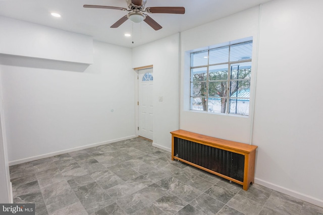 interior space featuring radiator heating unit and ceiling fan