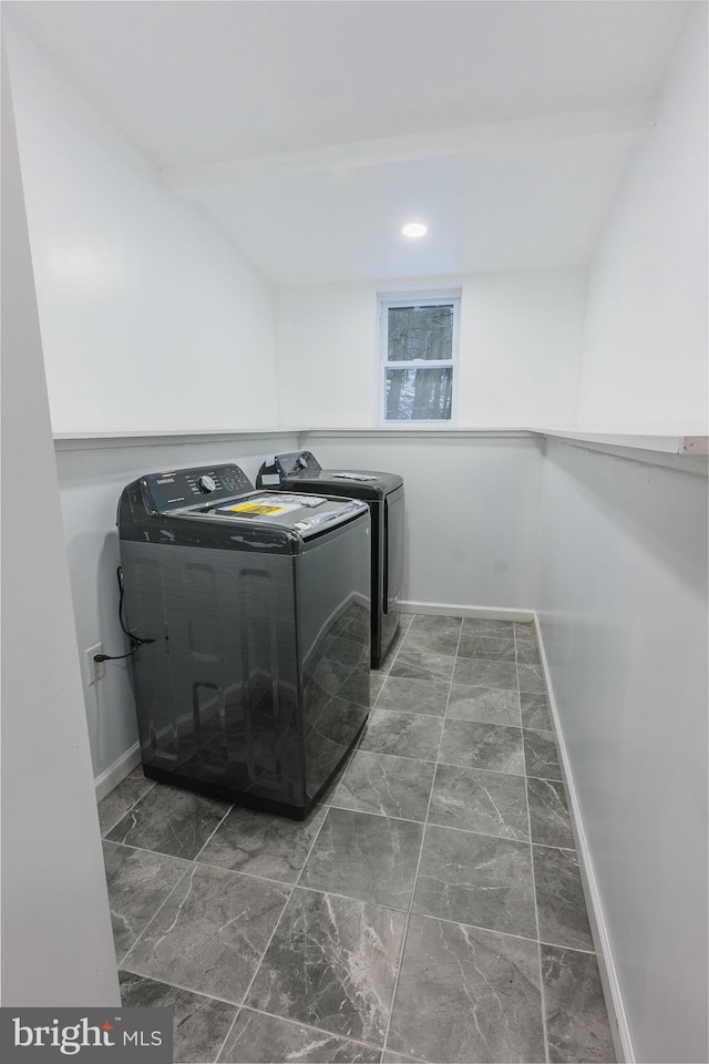 laundry room featuring washing machine and clothes dryer