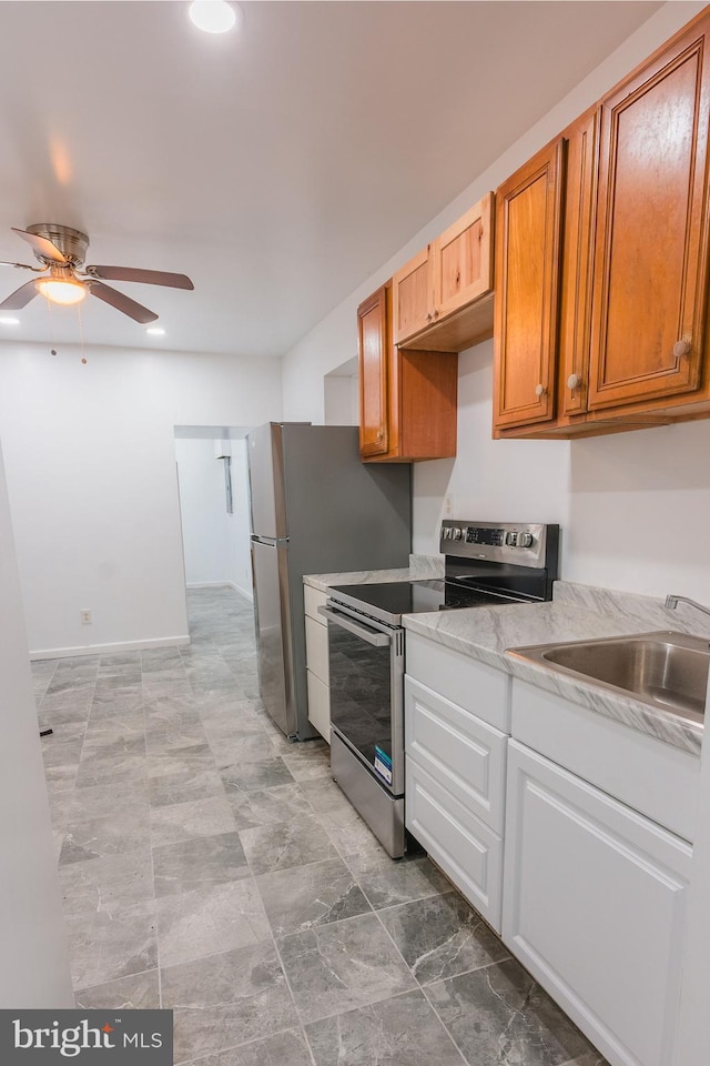 kitchen featuring sink, ceiling fan, and appliances with stainless steel finishes