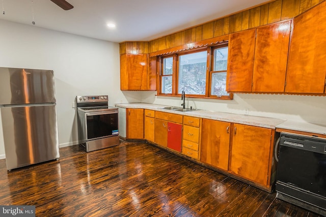 kitchen with ceiling fan, stainless steel appliances, dark hardwood / wood-style floors, and sink