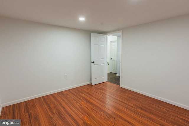 spare room featuring hardwood / wood-style floors