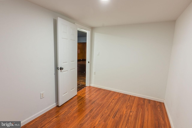 spare room featuring hardwood / wood-style flooring