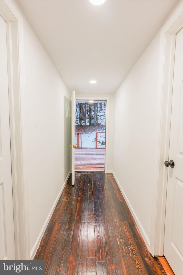 hall with dark hardwood / wood-style floors