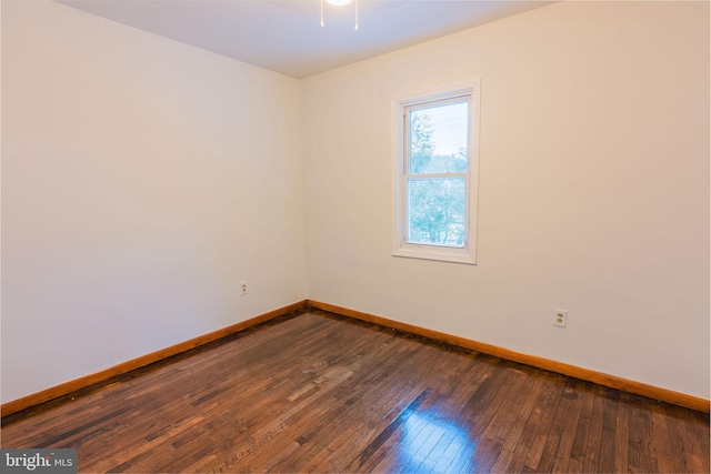 spare room featuring dark hardwood / wood-style flooring