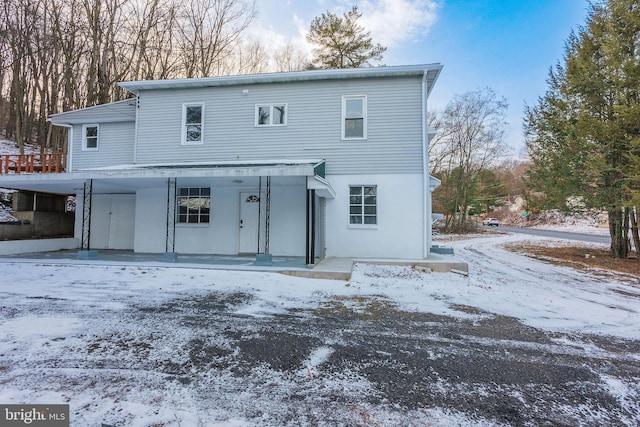 view of snow covered house