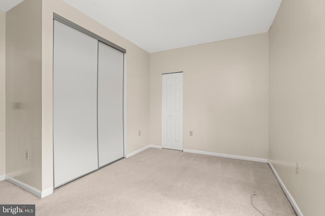 unfurnished bedroom with light carpet