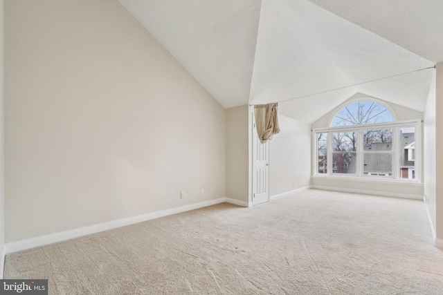 bonus room featuring lofted ceiling and carpet flooring