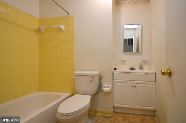 full bathroom with vanity, tiled shower / bath combo, and toilet