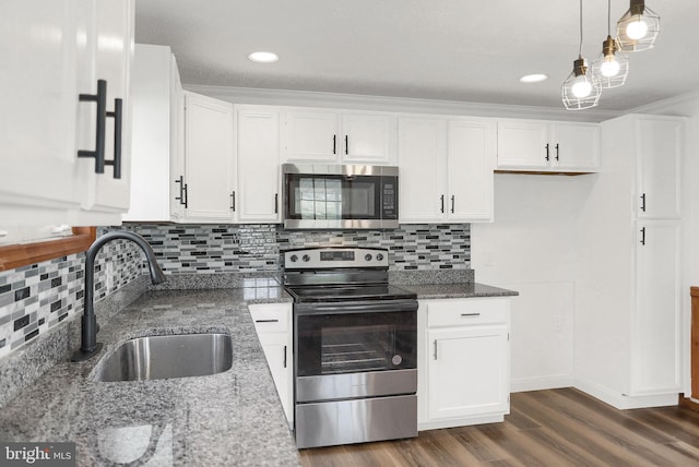 kitchen featuring white cabinetry, stainless steel appliances, and sink