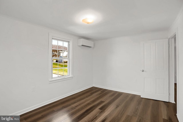 empty room featuring ornamental molding, dark hardwood / wood-style floors, and a wall unit AC