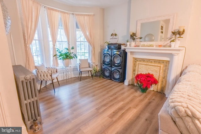 sitting room featuring hardwood / wood-style flooring and radiator heating unit