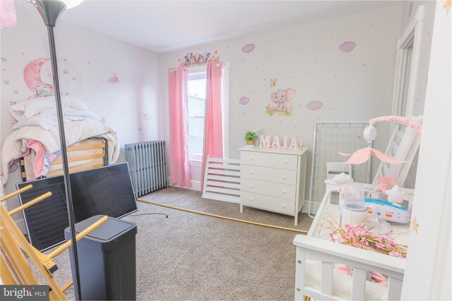 carpeted bedroom featuring radiator