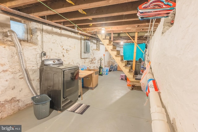 basement featuring electric panel and washer / clothes dryer