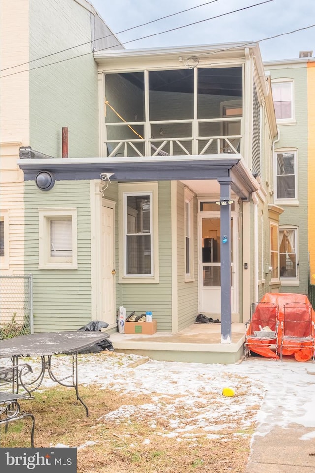 back of house with a balcony