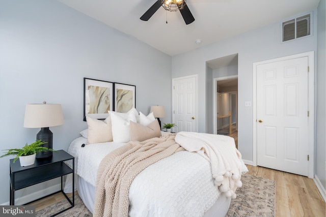 bedroom with ceiling fan and light hardwood / wood-style flooring