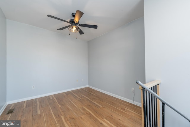 unfurnished room featuring ceiling fan and light wood-type flooring