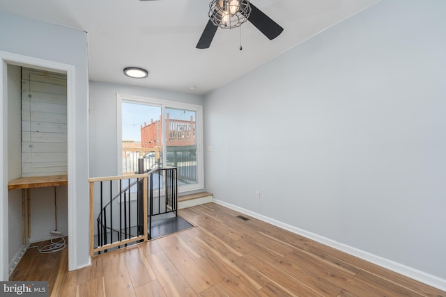 empty room featuring ceiling fan and wood-type flooring