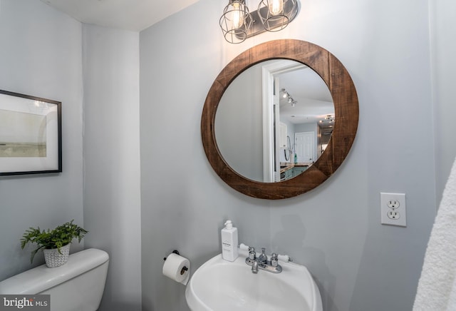 bathroom with sink and toilet