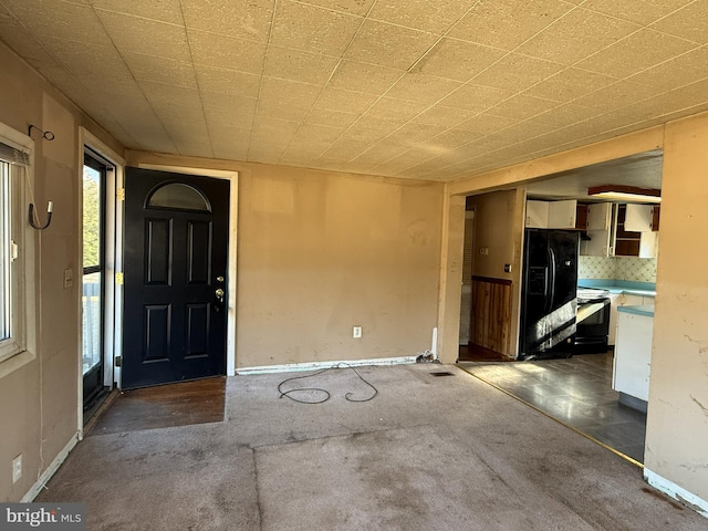 doorway to property with a patio area