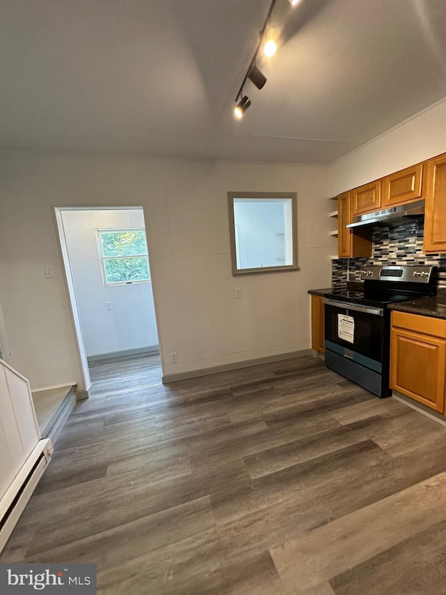 kitchen featuring a baseboard heating unit, track lighting, dark hardwood / wood-style flooring, and electric stove