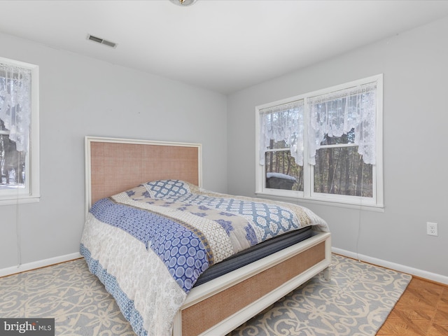 bedroom with parquet floors