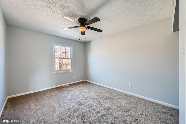 unfurnished room featuring a textured ceiling, ceiling fan, and carpet flooring