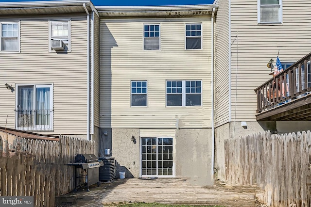 back of house featuring central AC and cooling unit