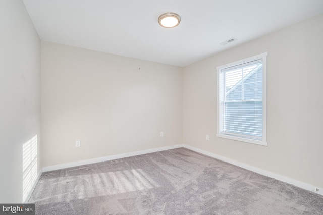 view of carpeted spare room